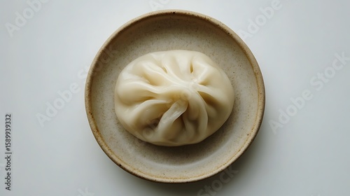 Fototapeta Naklejka Na Ścianę i Meble -  Steamed Bun on a Ceramic Plate