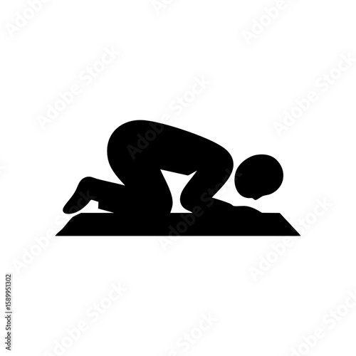 a man is praying on praying mat