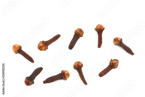 Dry cloves isolated on white background. Top view. Flat lay