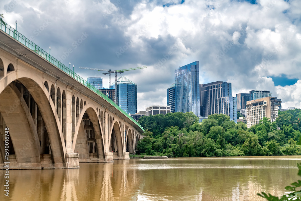 Fototapeta premium Modern Urban Planning across Potomac River, USA Capital Region A blend of nature and business development on the border of Washington and Virginia.
