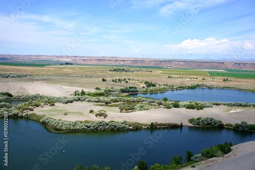 Calm Blue Lakes under Sunny Skies in a Sandy Landscape