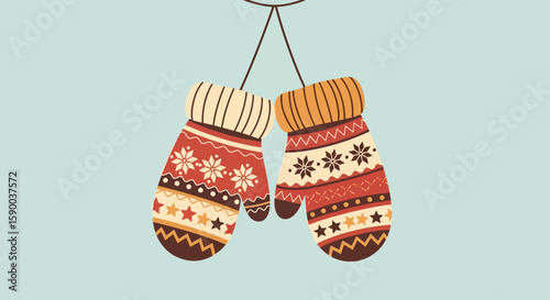 Colorful mittens hanging together with festive patterns on blue background  