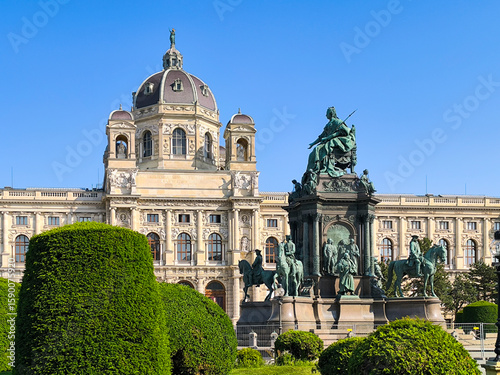 Kunsthistorisches museum of art with queen Maria Theresien statue and garden in foreground