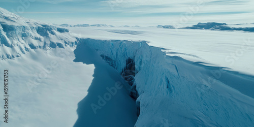 Experience the breathtaking aerial view of a captivating frozen glacier landscape