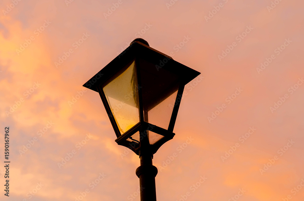 Obraz premium Close up, retro street lamp at sunset.