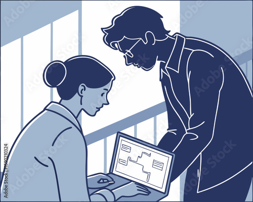 Two business professionals collaborating to analyze data on a laptop in a modern office