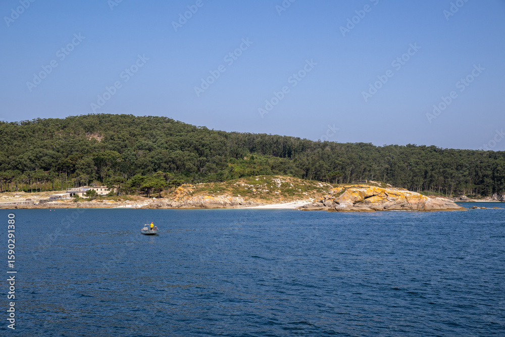 Obraz premium Stunning view of Cíes Islands and the Ons Sea in Galicia, Spain. Crystal-clear waters, rugged coastline, and natural beauty in this pristine Atlantic paradise.