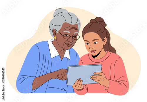 Mixed race grandmother using digital tablet with granddaughter
