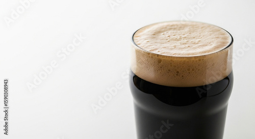 Glass of Dark Stout Beer with a Creamy Head
