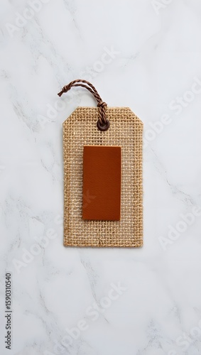 Burlap tag with brown label mockup for branding and product presentation on marble