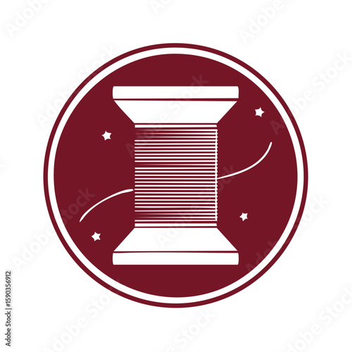 Bobbin of thread centered in maroon circle with shooting stars adds flair for sewing and crafting designs