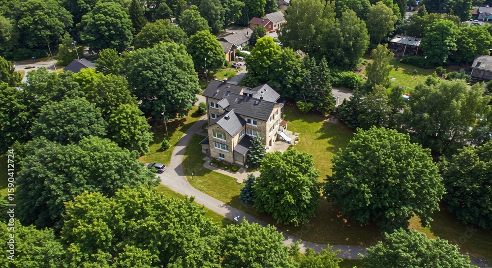 Fototapeta premium an aerial view of a house surrounded by trees