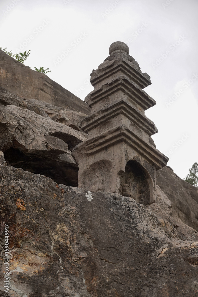 Naklejka premium Ancient Stone Pagoda at the Longmen Grottoes Site