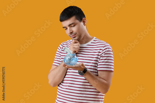 Thoughtful young man with p...