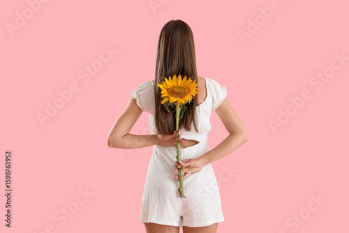 Young woman in white dress ...