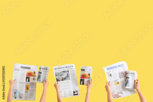 Women with newspapers on ye...