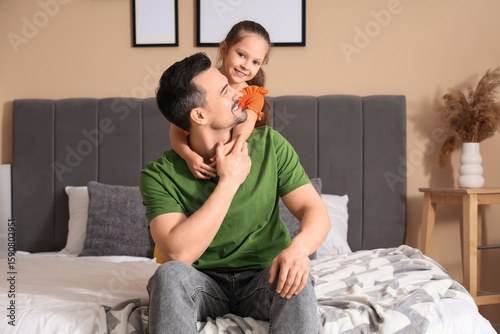 Father and his daughter pla...