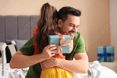 Father and his daughter hug...