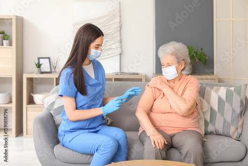 Young nurse vaccinating sen...
