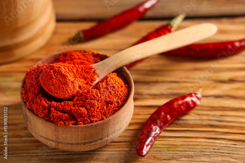 Vibrant red chili powder in...