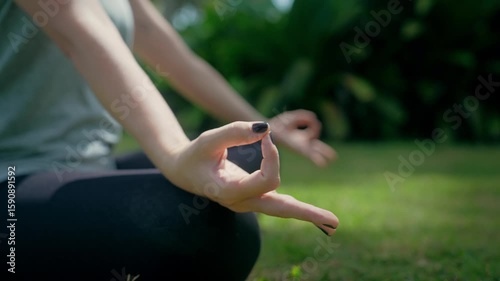 Beautiful Woman Performing Meditation at Yoga Studio in Nature Outdoor. Gymnast Girl Exercising for Body Health in Closeup Shot. Modern Life and Sporty Leisure of One Yogi Coach at Spiritual Workout