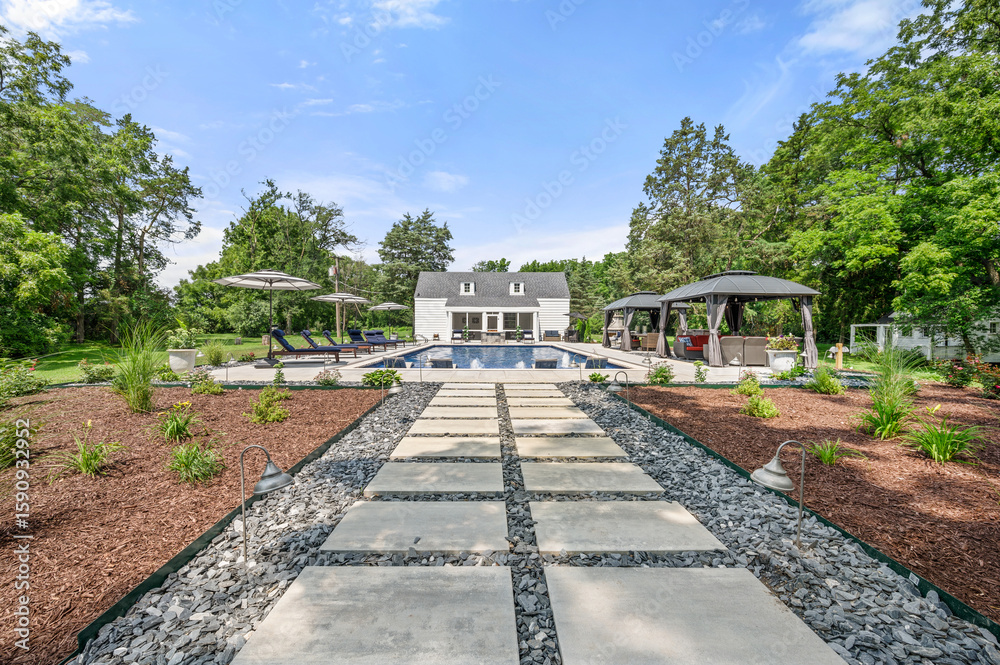 Fototapeta premium Luxury Backyard Pool with Modern Pool House and Lounge Area