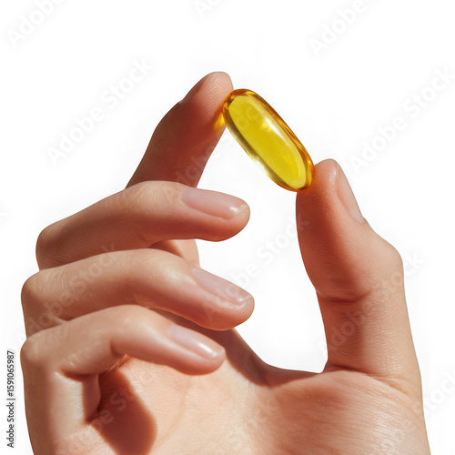 Hand holding a yellow capsule isolated on transparent background