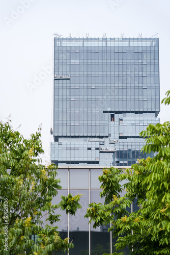 Modern commercial buildings are set in green and environmentally friendly green landscapes, with the appearance of commercial and office buildings and urban modern architectural structures