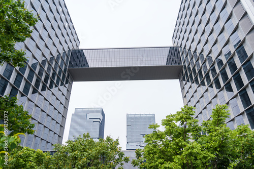 Modern commercial buildings are set in green and environmentally friendly green landscapes, with the appearance of commercial and office buildings and urban modern architectural structures