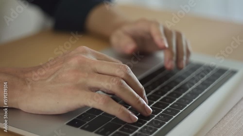 Man typing on laptop. Male working on computer. Typing hans close-up