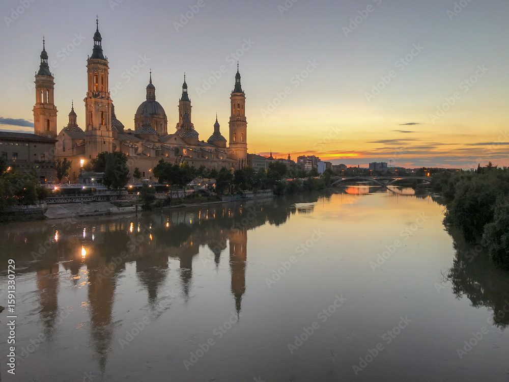 Fototapeta premium images of the basilica del pilar next to the ebro river