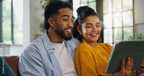 Fotografia Smile, couple and relax with tablet at house for social media, streaming film and bonding together
