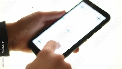 close-up shot of hand interact with white blank screen phone, isolated on white background