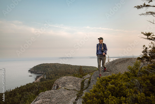 Wallpaper Mural Solo woman hikes along ridge with view, Acadia National Park, Maine Torontodigital.ca