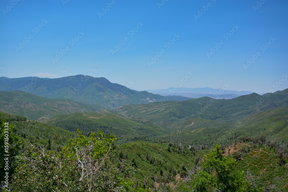 Fototapeta premium Wasatch Mountains in Utah, USA, in summer with mountains still covered by snow