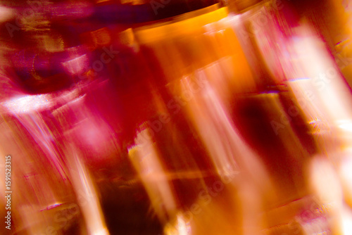 A abstract blurred streaks of red, orange, and white light, creating a dynamic and ethereal sense of motion and fluidity, color of hot desire emotion 
