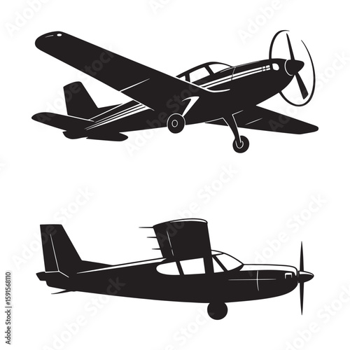 Two black airplanes flying in the sky aircraft aviation