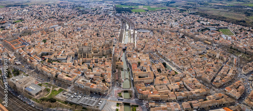 Fototapeta Naklejka Na Ścianę i Meble -   Aerial view of the city Narbonne in France on a sunny autumn day 