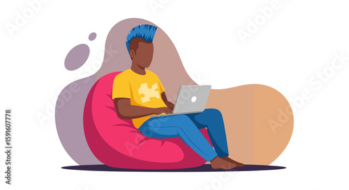 Young man working on laptop from beanbag chair, perfect for website banners or blog posts about remote work.