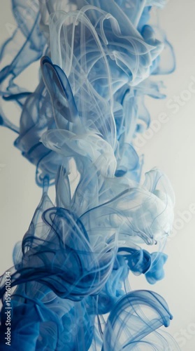 blue ink in water on white background, dreamy slow motion abstract visual