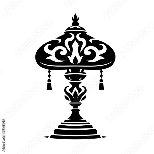An ornate vintage lamp with a decorative silhouette, isolated on a white background