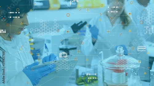 Laboratory scientist pipetting sample and initiating overlays as peer writing research observations
