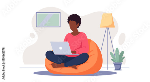 Person working from home on laptop, relaxing in beanbag chair. Perfect for remote work, freelance, and work-life balance concepts.