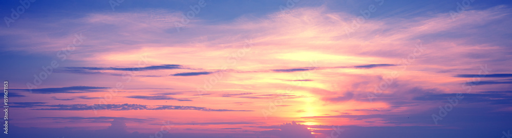 Fototapeta premium Colorful cloudy sky at sunset. Gradient color. Sky texture. Abstract nature background. Horizontal banner