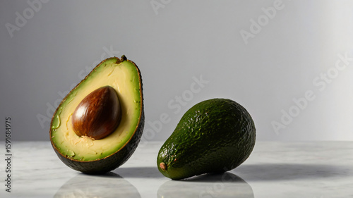 avocado cut in half isolated on gray background copy space