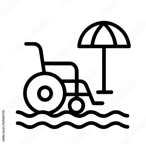 Accessible beach wheelchair next to umbrella on sandy shore  