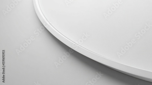 White, curved, geometric lighting fixture detail