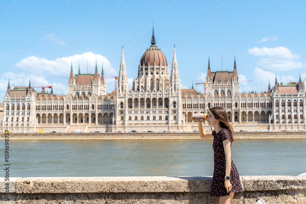 Obraz premium Playful Tourist in Budapest with Traditional Chimney Cake