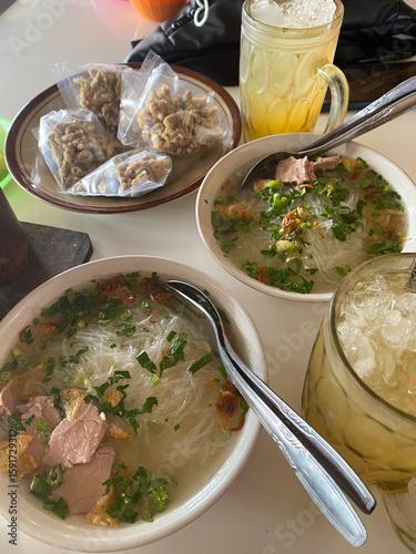 Soto Daging Sapi. Indonesian Food in a white bowl. Traditional Beef in a clear soup.