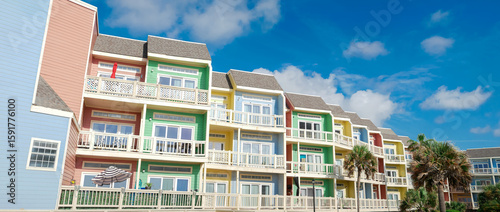 Vászonkép Panorama view colorful beach townhouses white painted balconies blue sky